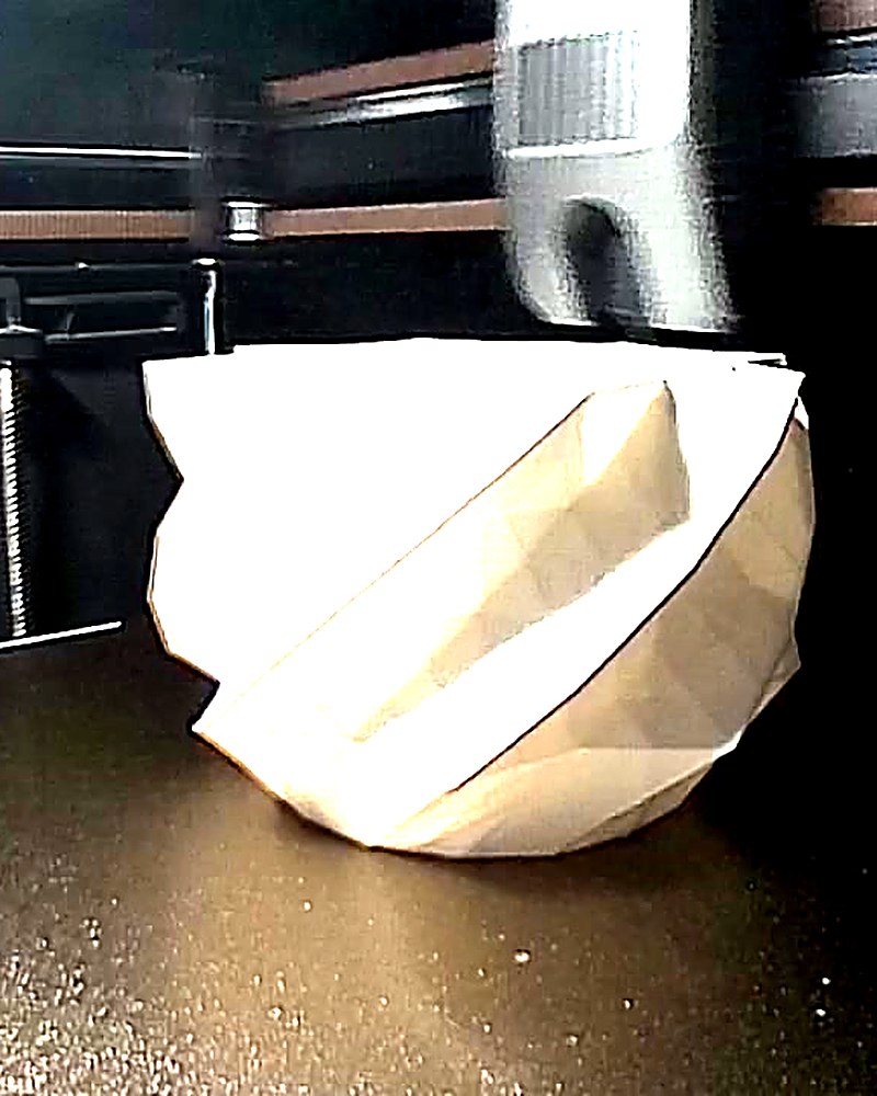 The same vase halfway up, its twist starting to show.